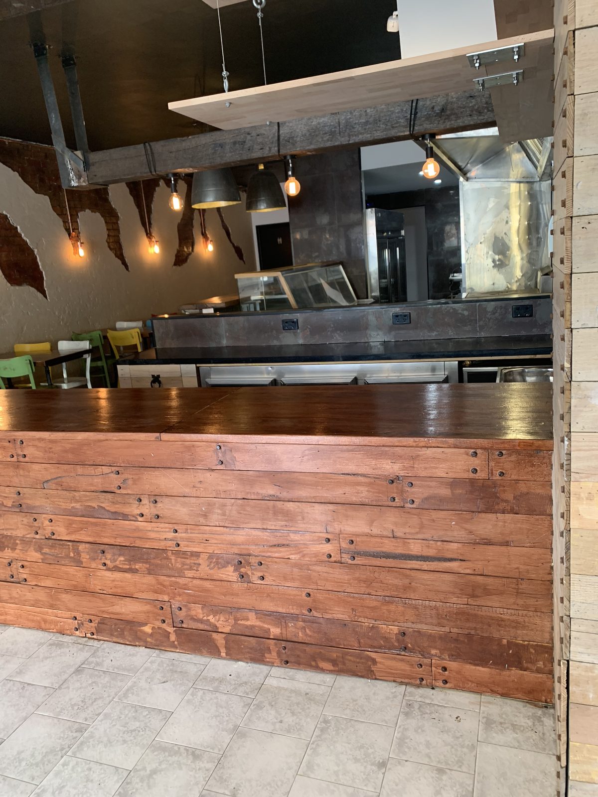 Recycled hardwood service counter with an oiled timber top, looking past it to the kitchen, Coal Workshop, Melbourne’s west.